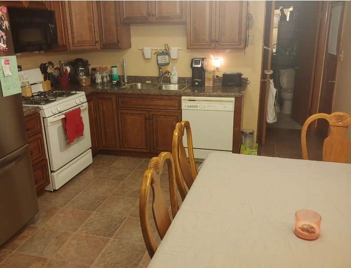 Kitchen after cleaning — clear counters, clean surfaces, organized space