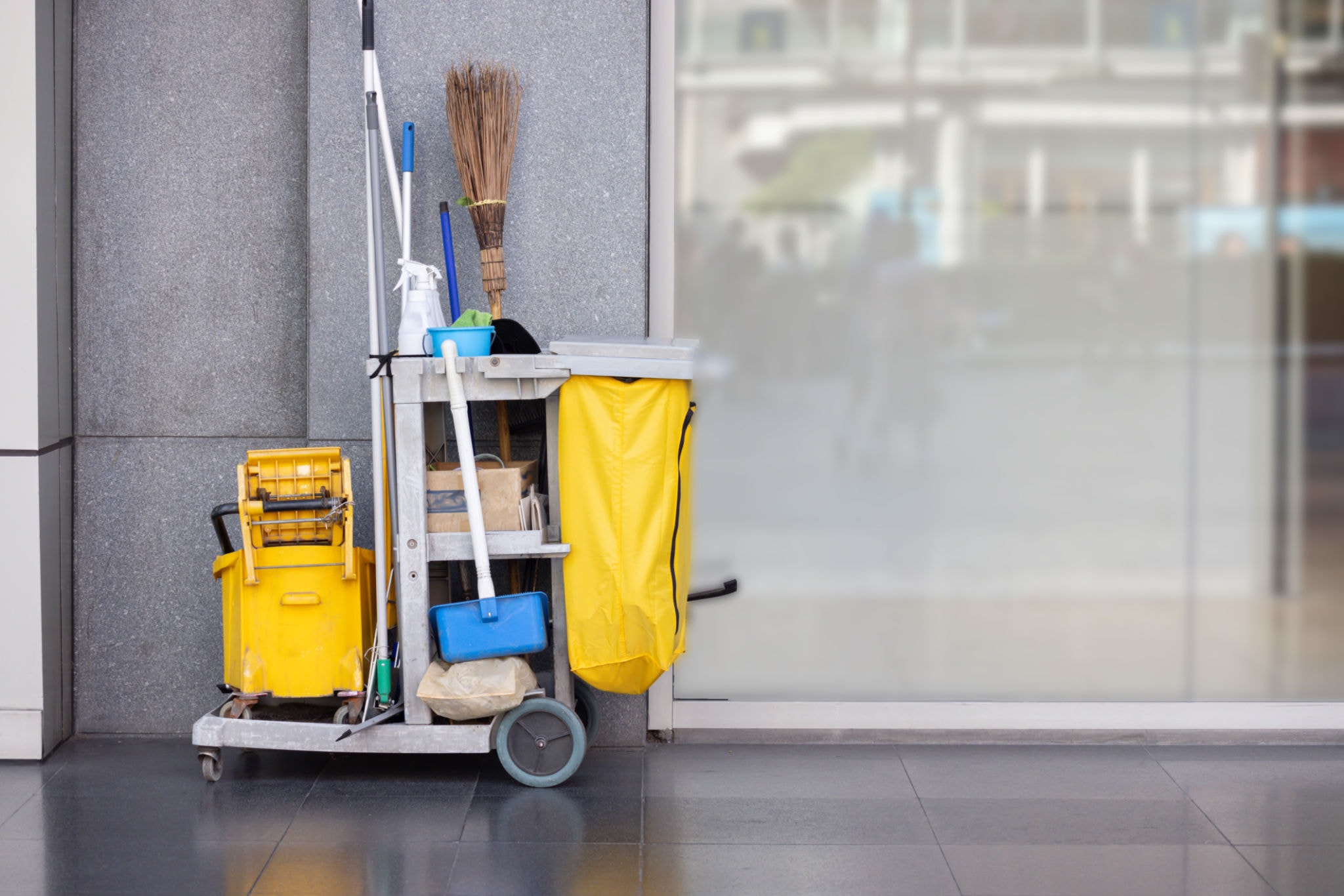 Professional janitorial cart stocked with cleaning supplies