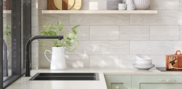 Spotless modern kitchen with white subway tile backsplash and green plants